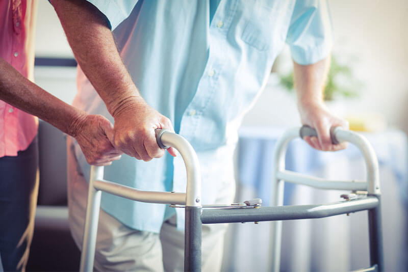 Image of person using a walker